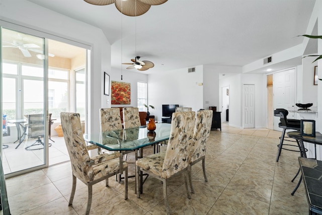 dining room featuring visible vents, light tile patterned flooring, and ceiling fan