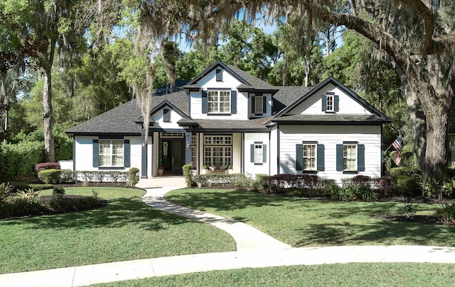 113 Holly Berry Ln, Saint Johns, FL 32259 - view of front of property featuring a shingled roof and a front yard