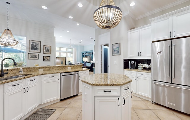 113 Holly Berry Ln, Saint Johns, FL 32259 - kitchen featuring backsplash, a sink, light tile patterned floors, stainless steel appliances, and an inviting chandelier