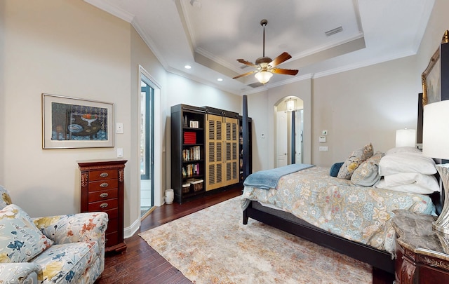 113 Holly Berry Ln, Saint Johns, FL 32259 - bedroom with dark wood-style flooring, visible vents, ornamental molding, a raised ceiling, and arched walkways