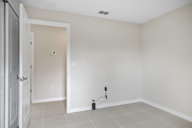 laundry room with light tile patterned floors