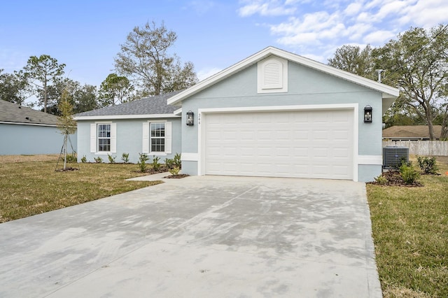 single story home featuring central AC, a garage, and a front yard