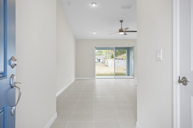 hallway with light tile patterned floors