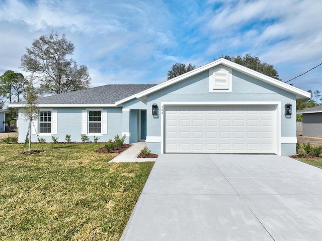 ranch-style home featuring a garage and a front yard