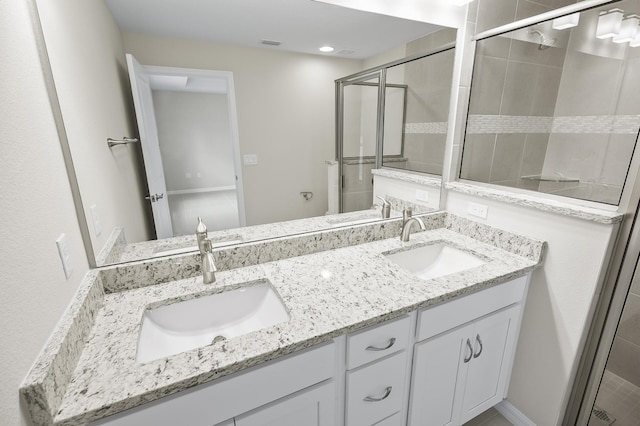 bathroom with vanity and walk in shower