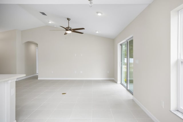 unfurnished room featuring light tile patterned floors, vaulted ceiling, and ceiling fan