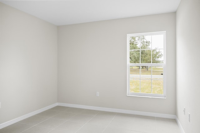 spare room featuring light tile patterned floors