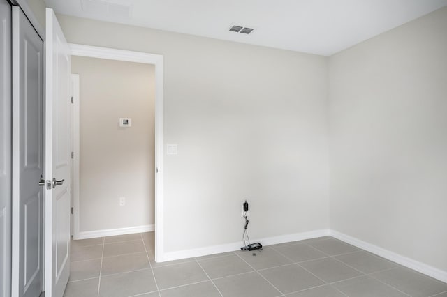 laundry area featuring light tile patterned flooring