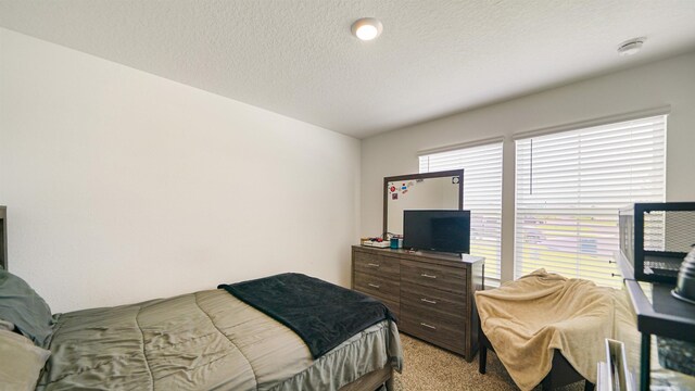 4004 Chihuahua Ct, Jacksonville, FL 32218 - bedroom with light colored carpet and a textured ceiling
