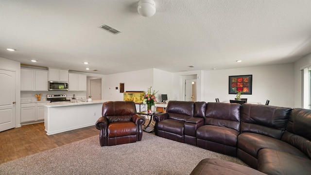 4004 Chihuahua Ct, Jacksonville, FL 32218 - living room featuring recessed lighting and dark wood-type flooring