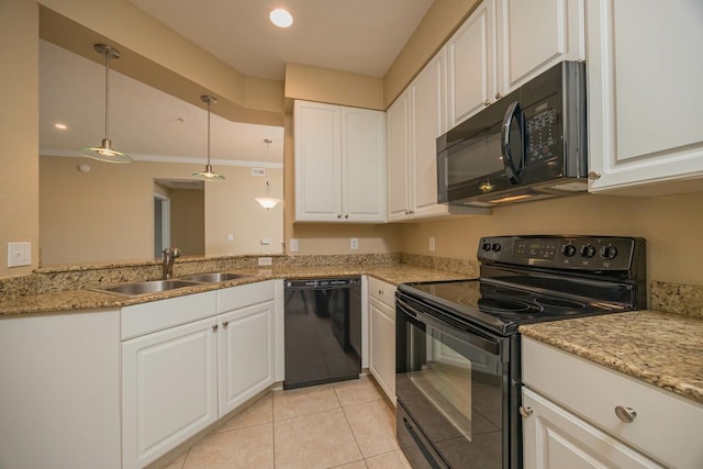 kitchen with sink, light stone counters, pendant lighting, black appliances, and white cabinets