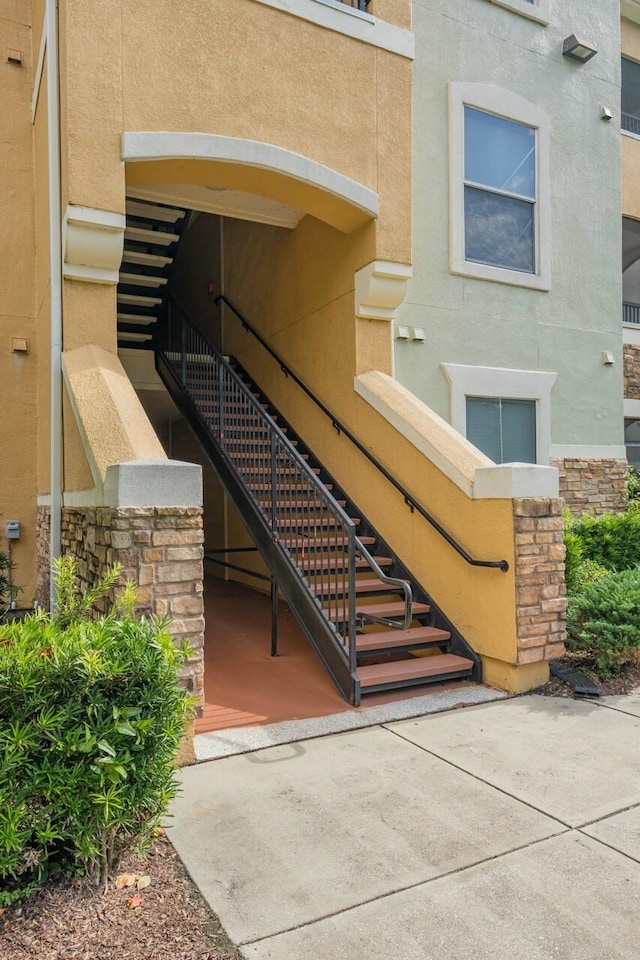 8539 Gate Pkwy Unit 431, Jacksonville, FL 32216 - view of exterior entry featuring stone siding and stucco siding