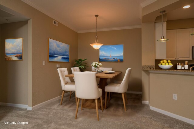 dining area with crown molding and light colored carpet