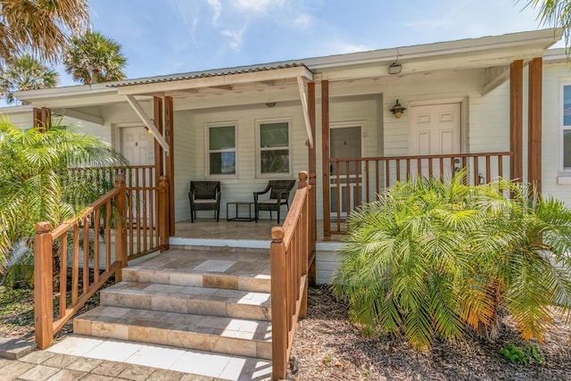 doorway to property with a porch