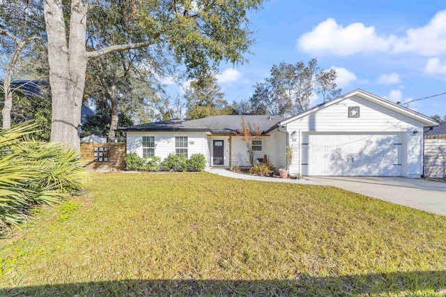 ranch-style house featuring a garage and a front lawn