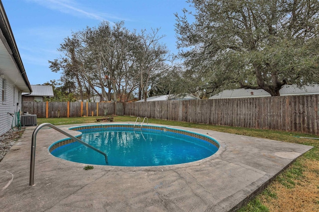 view of pool featuring cooling unit and a patio area