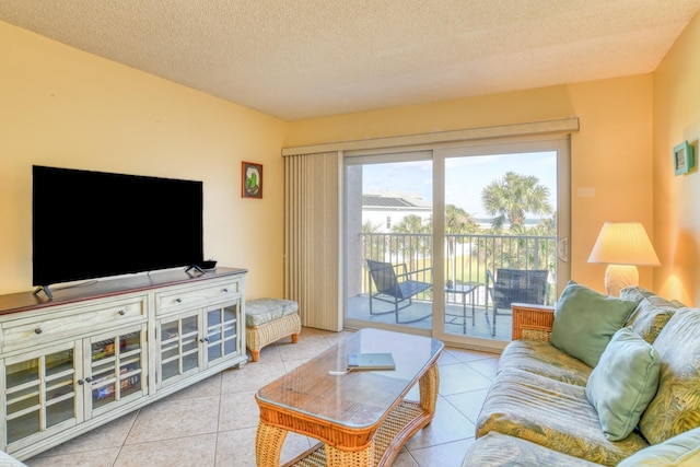 4 Ocean Trace Rd Unit 323, Saint Augustine Beach, FL 32080 - tiled living room featuring a textured ceiling