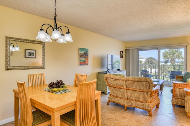 4 Ocean Trace Rd Unit 323, Saint Augustine Beach, FL 32080 - dining area with a chandelier, a textured ceiling, and light tile patterned floors
