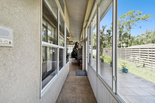 unfurnished sunroom featuring a wealth of natural light