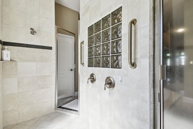 bathroom with a tile shower