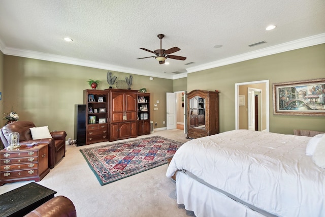 bedroom with light carpet, a textured ceiling, ceiling fan, and ornamental molding