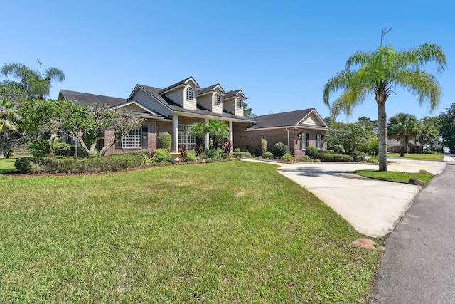 cape cod house featuring a front lawn