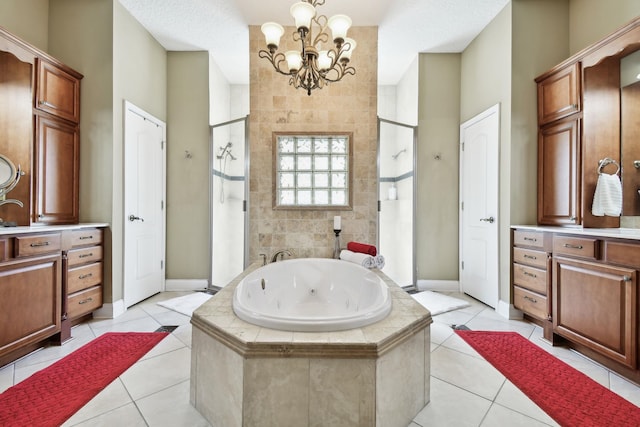 bathroom with tile patterned flooring, vanity, plus walk in shower, and a chandelier