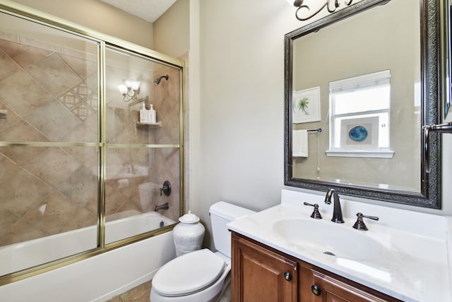 full bathroom featuring vanity, bath / shower combo with glass door, and toilet