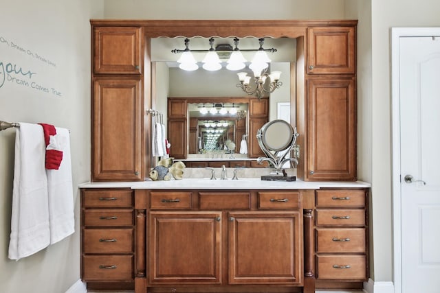 bathroom featuring vanity and a notable chandelier