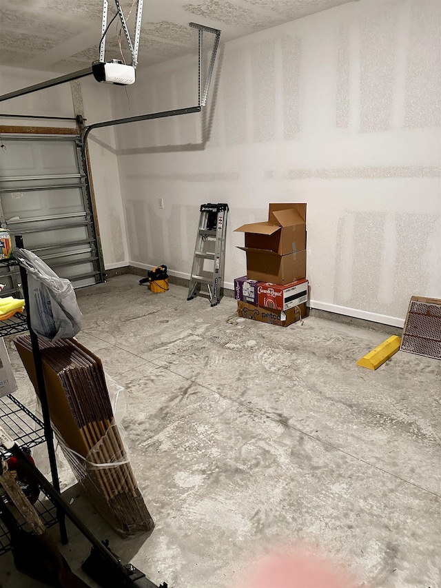 303 Redbud Rd, Palm Coast, FL 32137 - garage with baseboards and a garage door opener