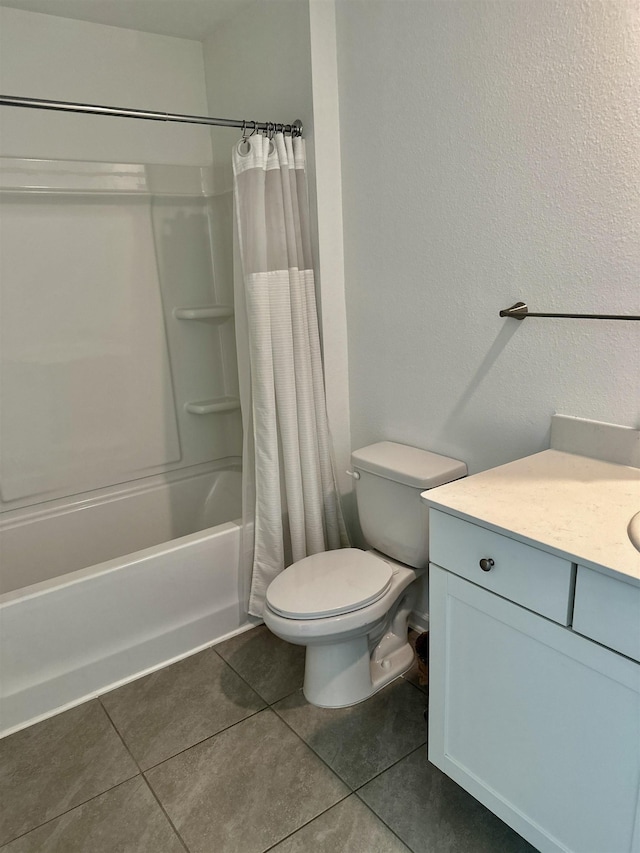303 Redbud Rd, Palm Coast, FL 32137 - full bathroom featuring tile patterned floors, shower / tub combo, vanity, toilet, and a textured wall