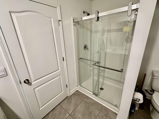 303 Redbud Rd, Palm Coast, FL 32137 - bathroom with toilet, a stall shower, and tile patterned flooring