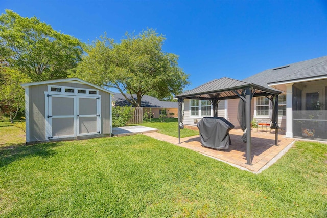 301 Graciela Cir, Saint Augustine, FL 32086 - view of yard featuring fence, a storage shed, a patio area, an outdoor structure, and a gazebo