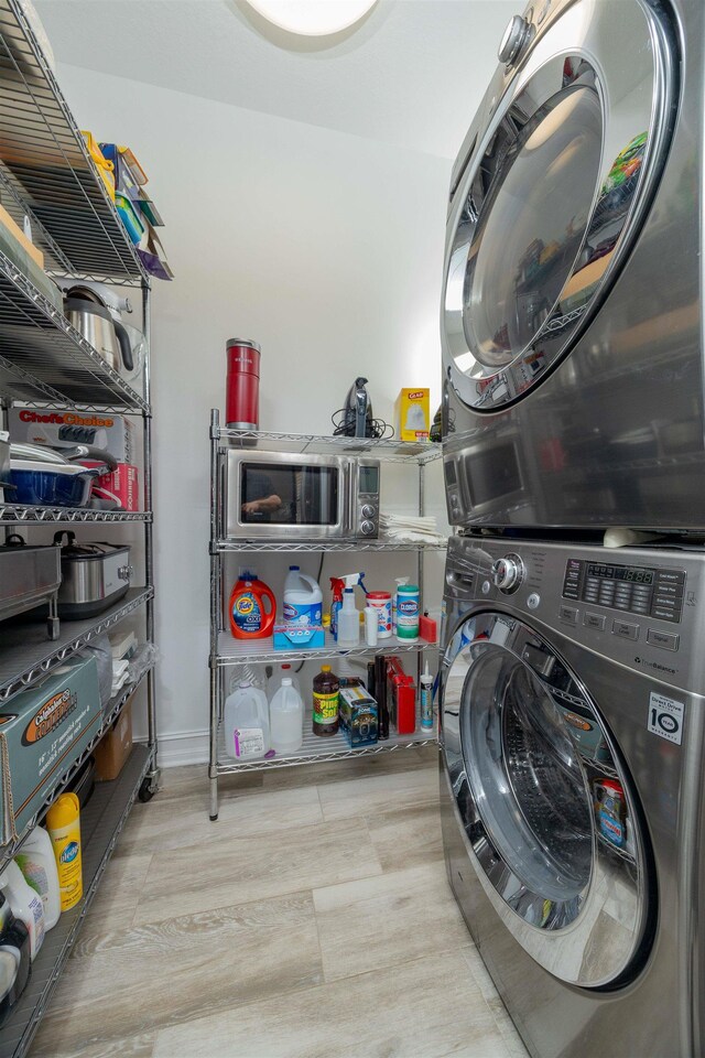 301 Graciela Cir, Saint Augustine, FL 32086 - clothes washing area with stacked washer and clothes dryer and laundry area