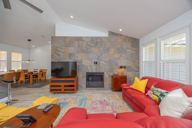 301 Graciela Cir, Saint Augustine, FL 32086 - living room with a fireplace, vaulted ceiling, and ceiling fan