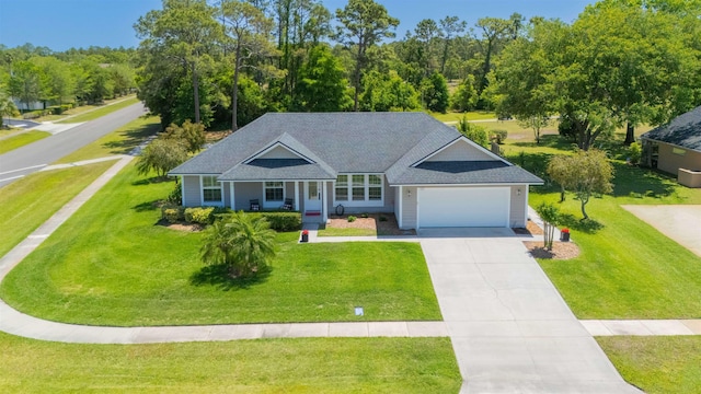 301 Graciela Cir, Saint Augustine, FL 32086 - view of front facade with an attached garage, a shingled roof, driveway, and a front yard