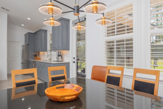 301 Graciela Cir, Saint Augustine, FL 32086 - dining space with vaulted ceiling, visible vents, and recessed lighting