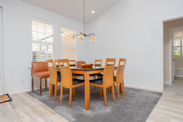 301 Graciela Cir, Saint Augustine, FL 32086 - dining room featuring recessed lighting, lofted ceiling, wood finished floors, baseboards, and a notable chandelier