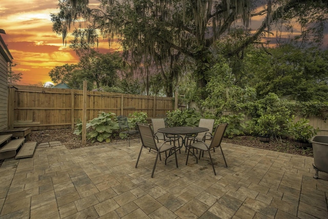 view of patio terrace at dusk