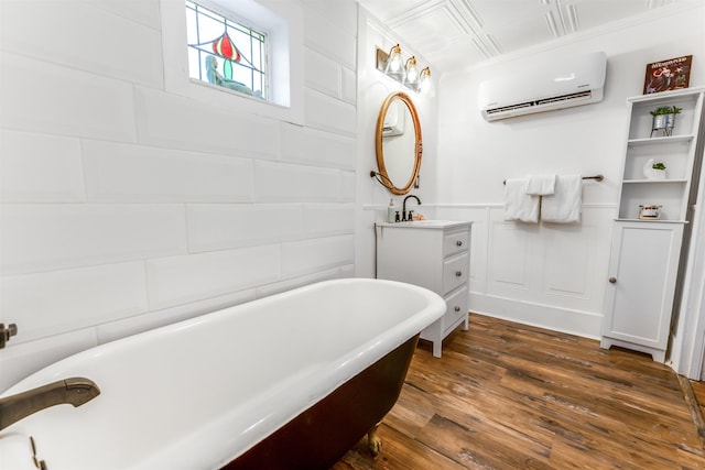 bathroom with a tub to relax in, vanity, hardwood / wood-style flooring, and a wall unit AC