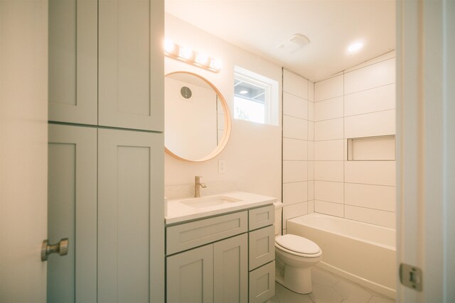 full bathroom with tile patterned flooring, vanity, toilet, and tiled shower / bath combo