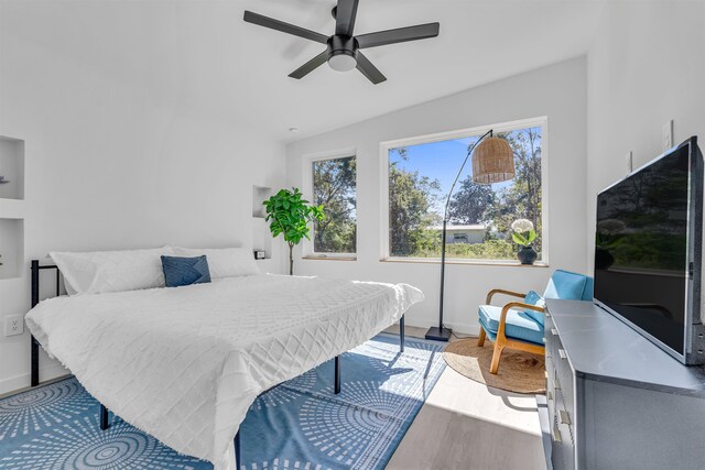 bedroom featuring light wood-type flooring and ceiling fan