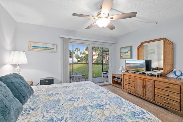 bedroom with access to exterior, light tile patterned flooring, a textured ceiling, and ceiling fan
