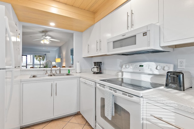kitchen with white appliances, a sink, light countertops, white cabinetry, and ceiling fan