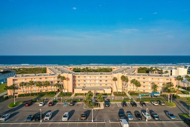 bird's eye view of a nearby body of water and apartment complex / building