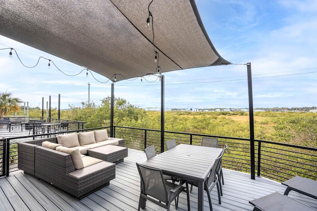 wooden deck featuring outdoor lounge area