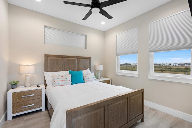 bedroom featuring light hardwood / wood-style flooring and ceiling fan