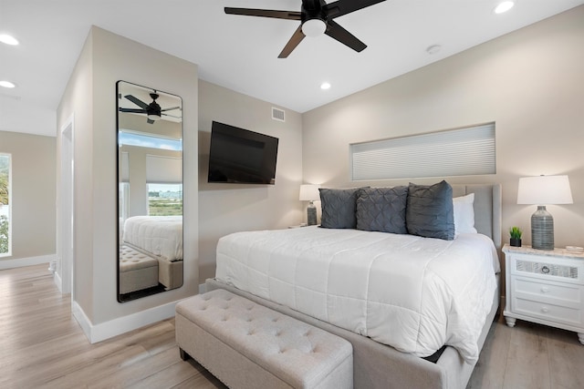 bedroom featuring ceiling fan and light wood-type flooring