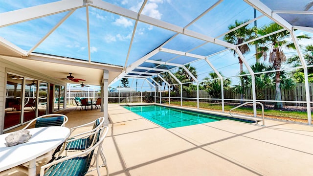 40 Sandpiper Dr, Saint Augustine, FL 32080 - view of swimming pool featuring a fenced backyard, a patio area, a ceiling fan, a lanai, and outdoor dining space