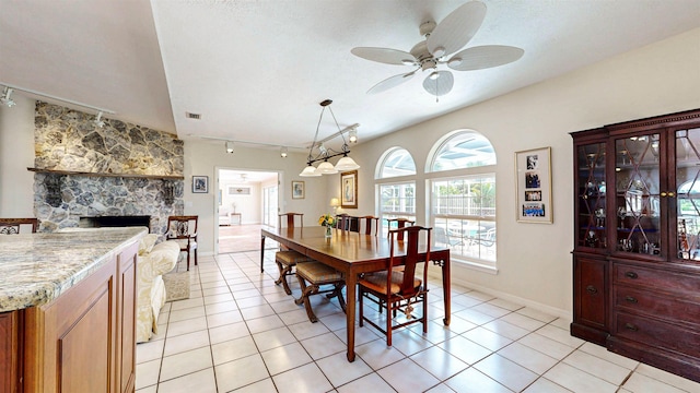40 Sandpiper Dr, Saint Augustine, FL 32080 - dining room featuring track lighting, ceiling fan, light tile patterned floors, a fireplace, and baseboards